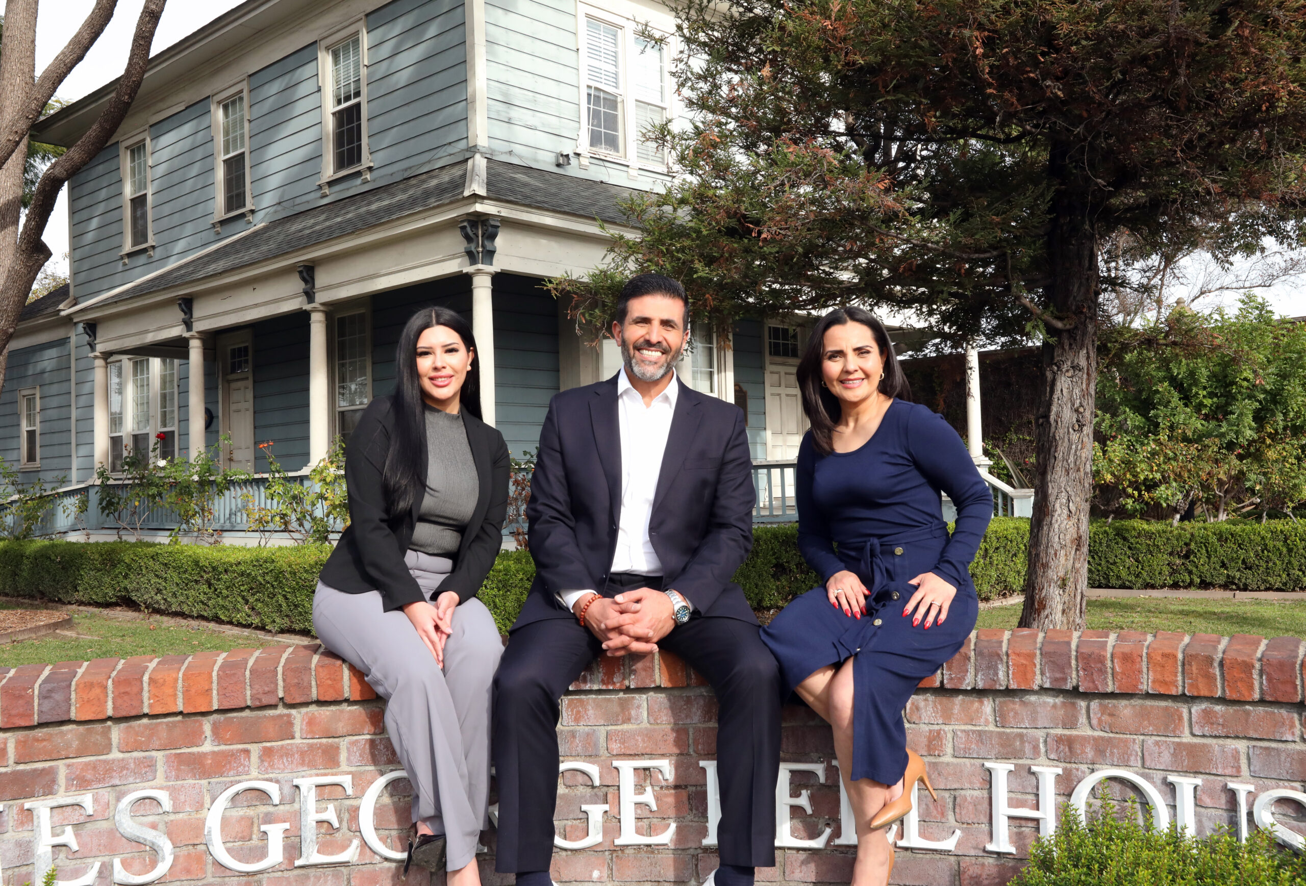 FRANCIS FLORES, ALI SALEH & MONICA ARROYO in front of historic George Bell House in Bell, California.